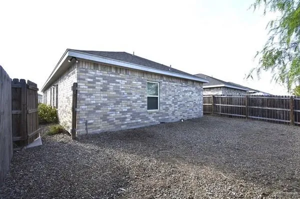 a front view of a house with parking space