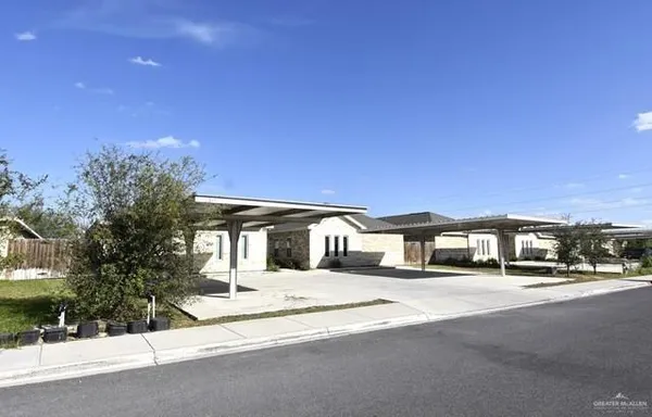 a front view of a building with street view