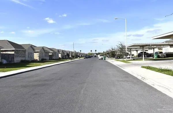 a view of city street with a houses