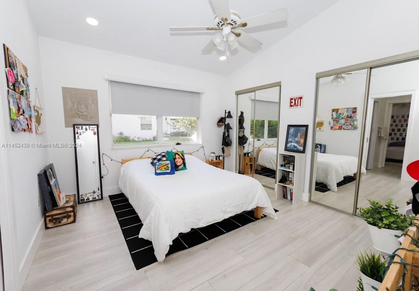 6110 Falconsgate Avenue Davie, FL 33331 - Photo 25 of 33 a bedroom with a bed a large window with table and chairs