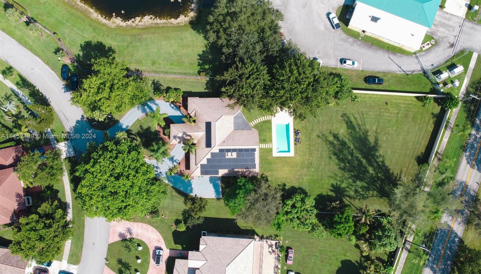 6110 Falconsgate Avenue Davie, FL 33331 - Photo 33 of 33 an aerial view of a house with a yard and garden