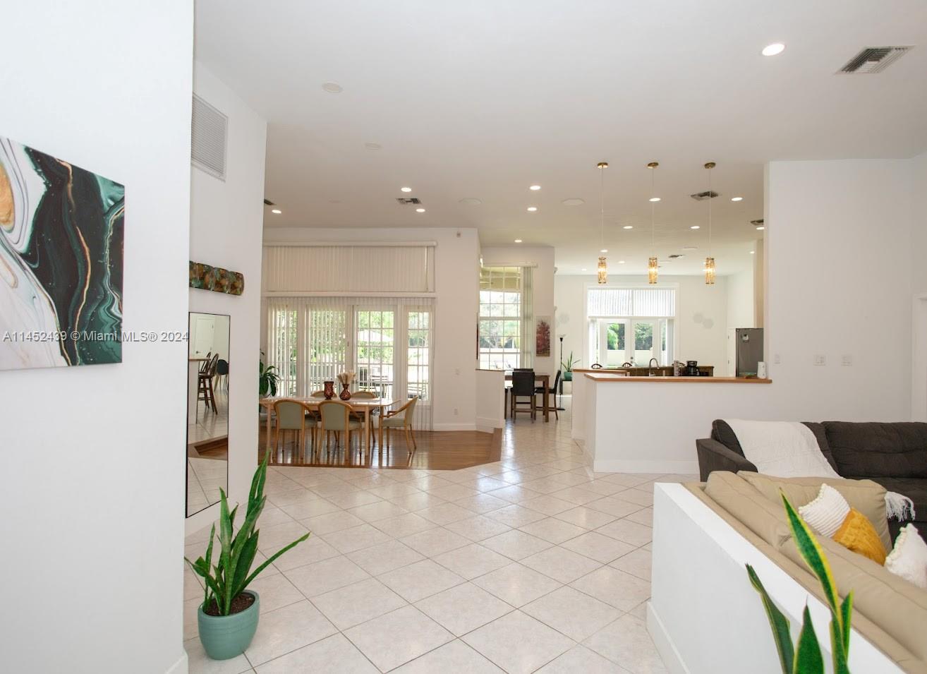 6110 Falconsgate Avenue Davie, FL 33331 - Photo 5 of 33 a lobby with furniture and a view of living room