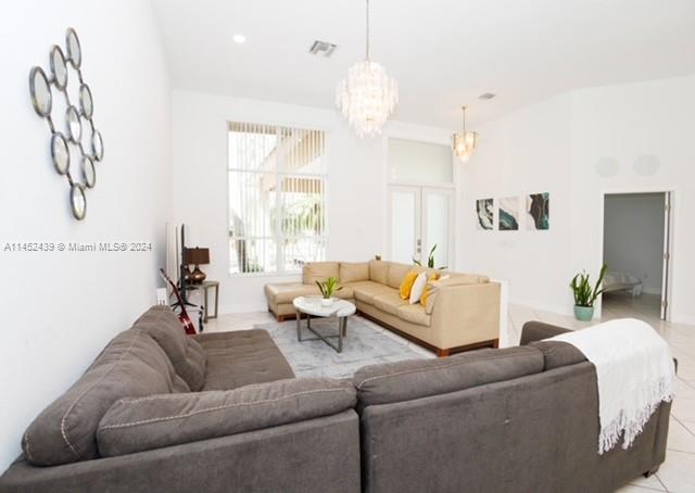6110 Falconsgate Avenue Davie, FL 33331 - Photo 7 of 33 a living room with furniture and a large window