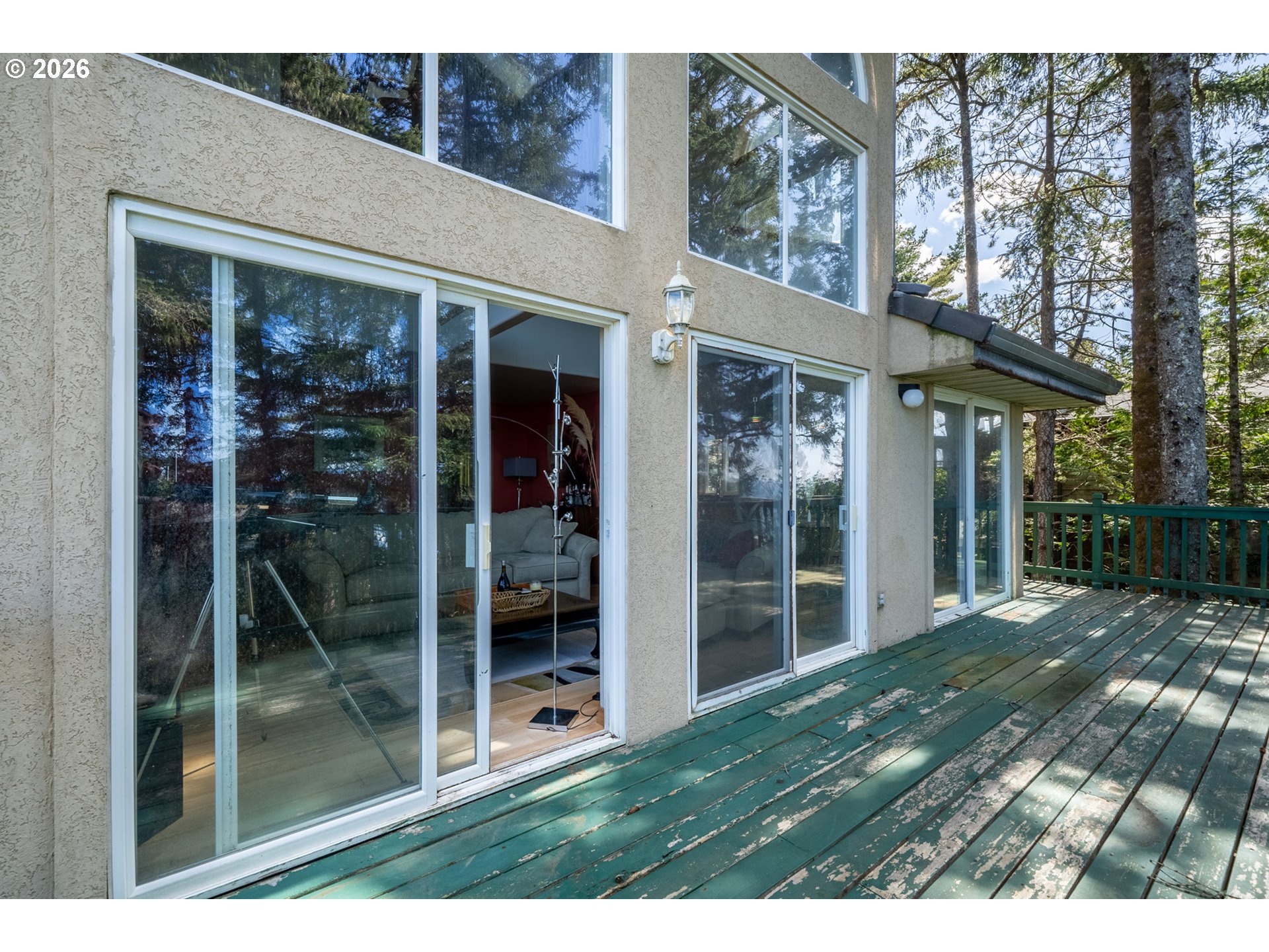 6095 Huckleberry Lane Oceanside, OR 97141 - Photo 12 of 48 a view of backyard with porch