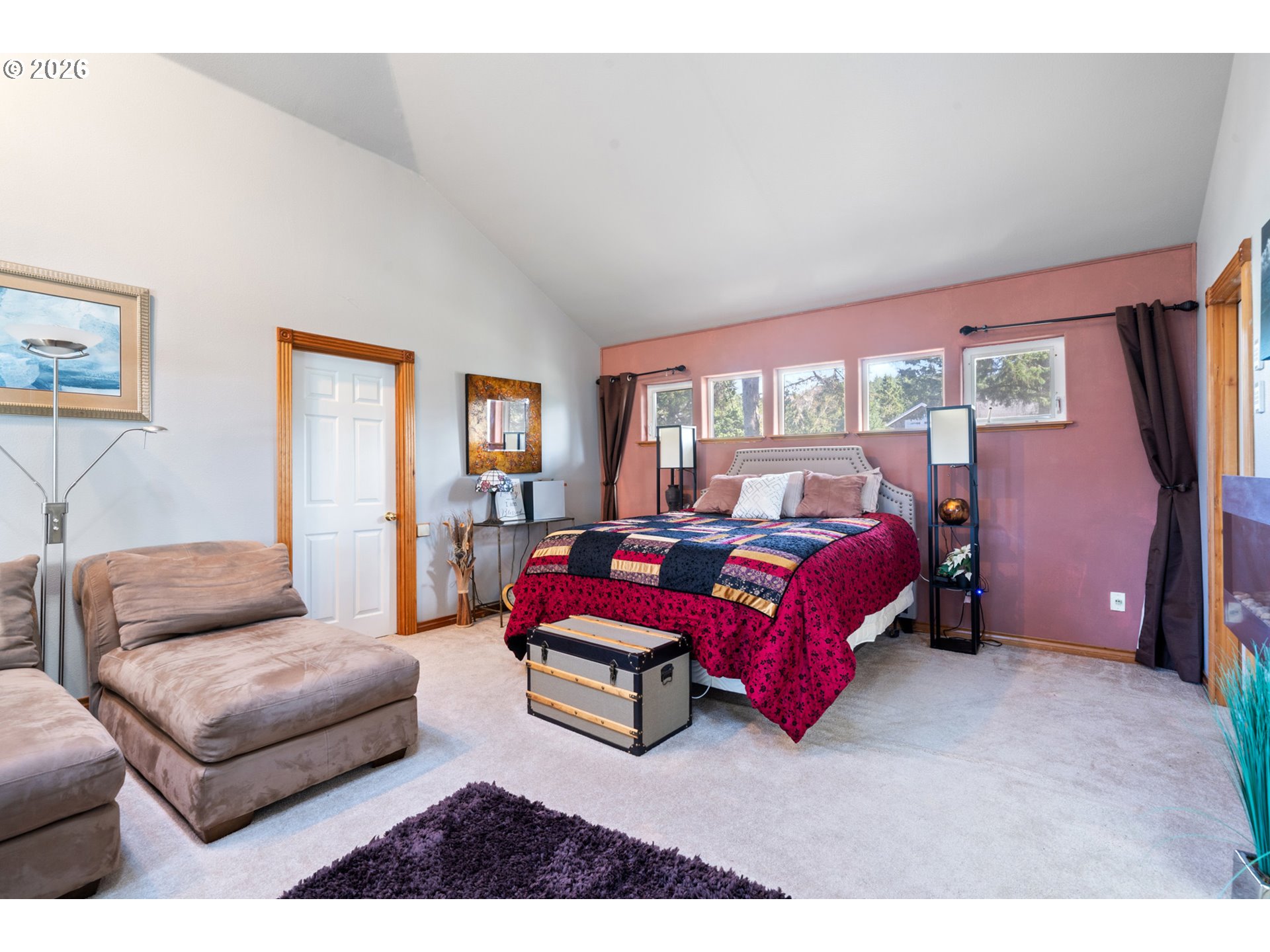 6095 Huckleberry Lane Oceanside, OR 97141 - Photo 21 of 48 a bedroom with furniture and a window