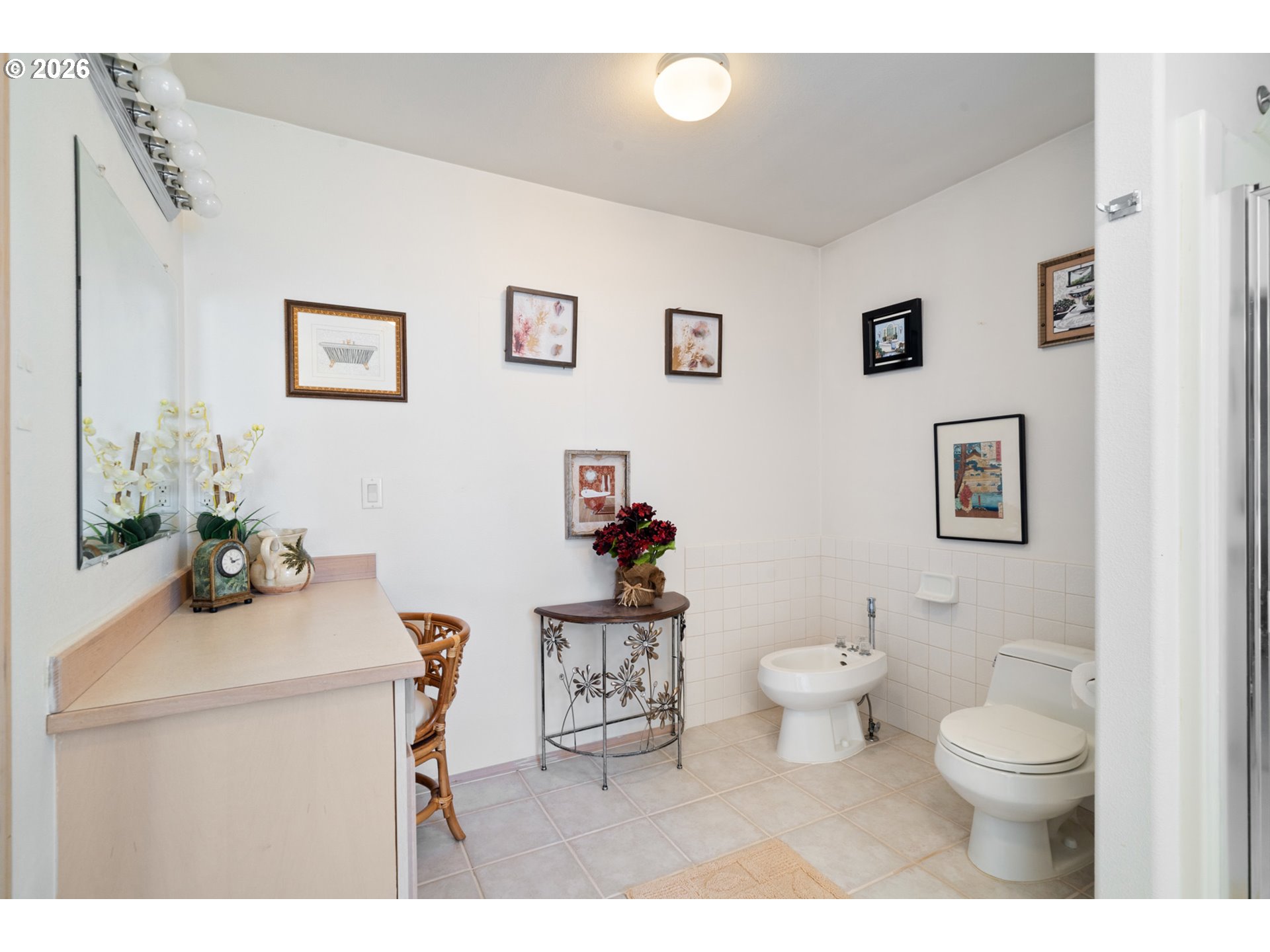 6095 Huckleberry Lane Oceanside, OR 97141 - Photo 23 of 48 a bathroom with a sink a toilet and a mirror