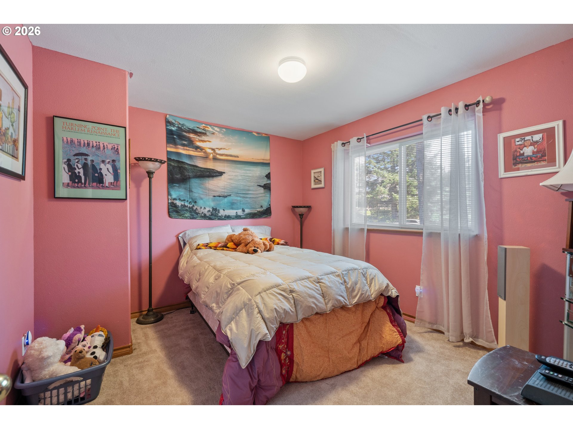 6095 Huckleberry Lane Oceanside, OR 97141 - Photo 32 of 48 a bed sitting in a bedroom next to a window