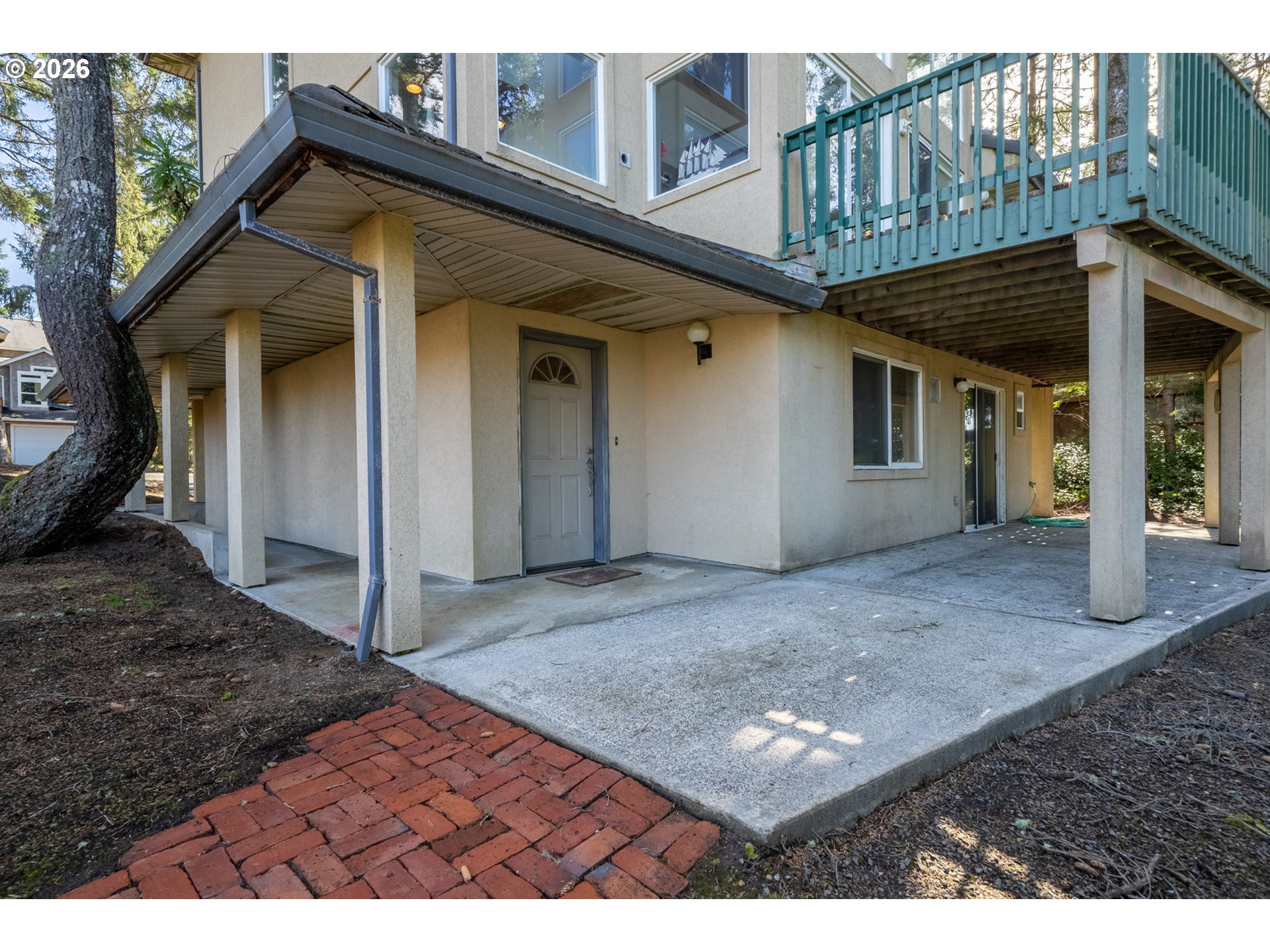 6095 Huckleberry Lane Oceanside, OR 97141 - Photo 36 of 48 a view of a house with backyard and porch