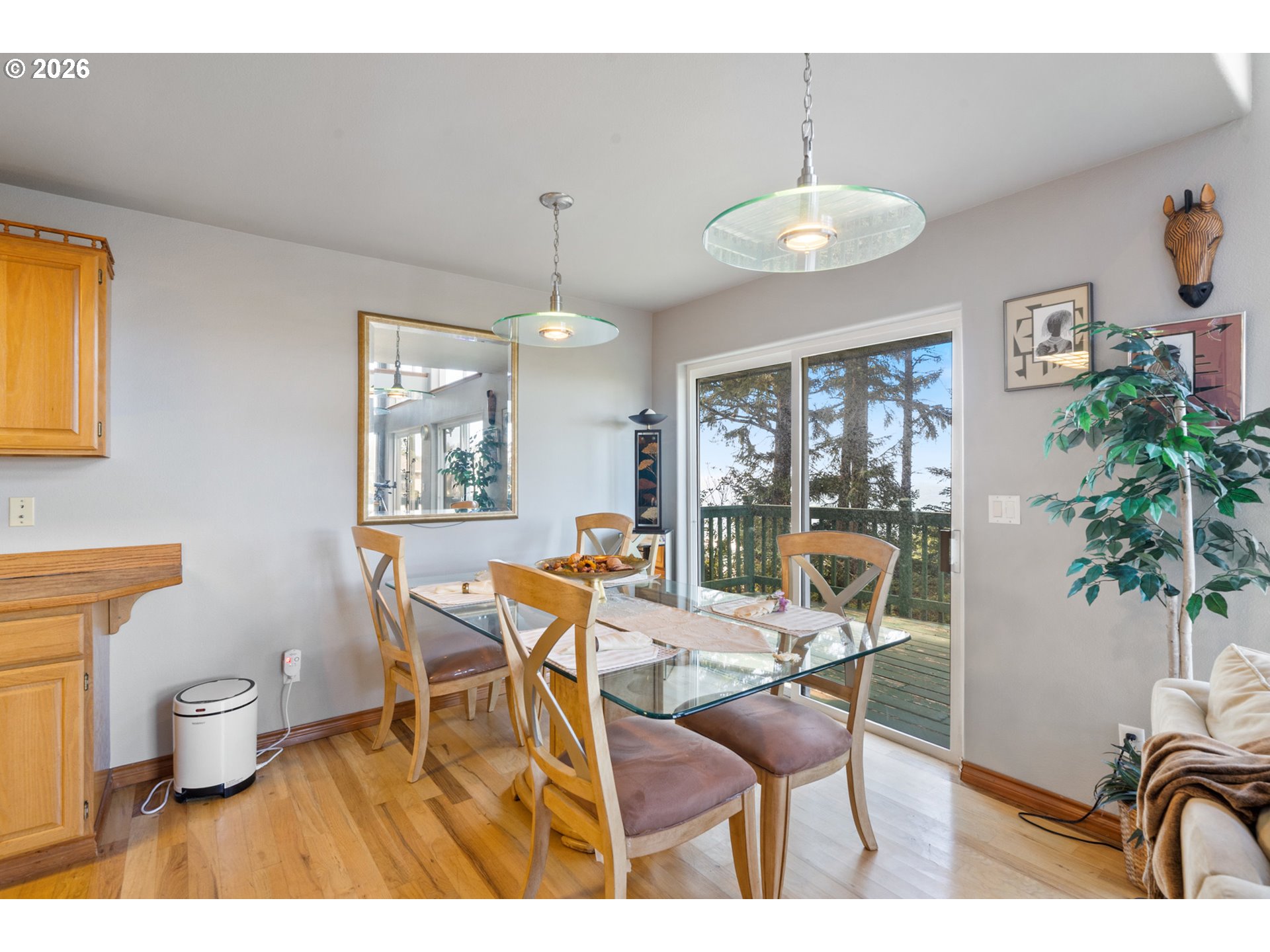 6095 Huckleberry Lane Oceanside, OR 97141 - Photo 10 of 48 a dining room with furniture and window
