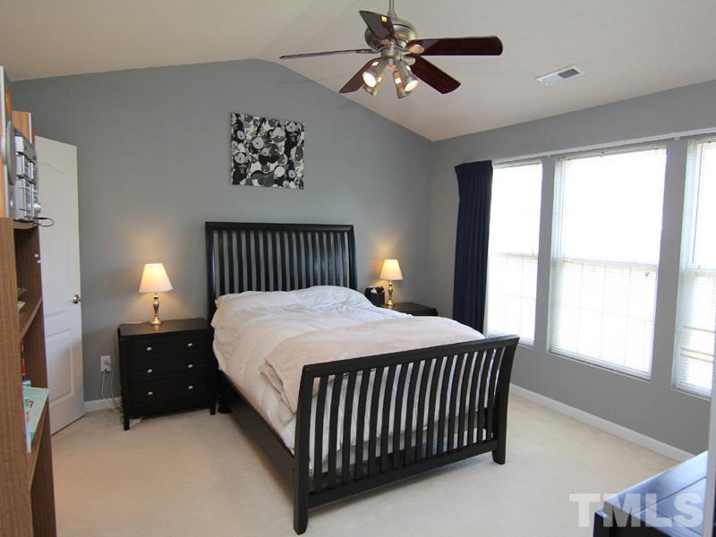 4822 Shallowbrook Trail Raleigh, NC 27616 - Photo 13 of 23 A vaulted ceiling and fan plus a wall of windows-great space.
