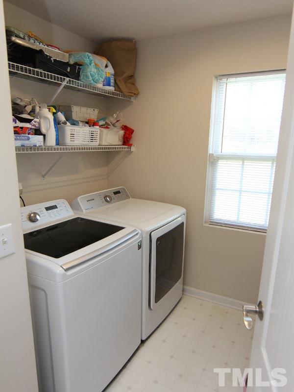 4822 Shallowbrook Trail Raleigh, NC 27616 - Photo 20 of 23 The first floor laundry room is conveniently located off the back hall by the garage.