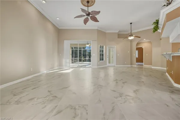 a view of an empty room with glass door