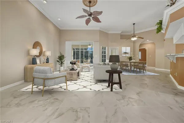 a living room with furniture a dining table and a piano table