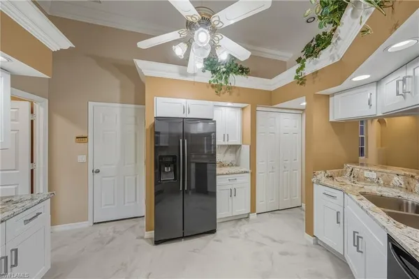 a bathroom with a granite countertop sink a large mirror and a shower
