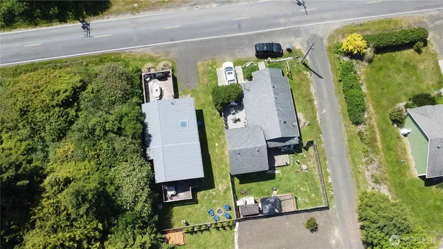 an aerial view of houses with yard