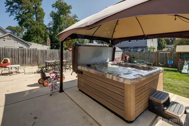 a view of backyard with a patio and outdoor seating