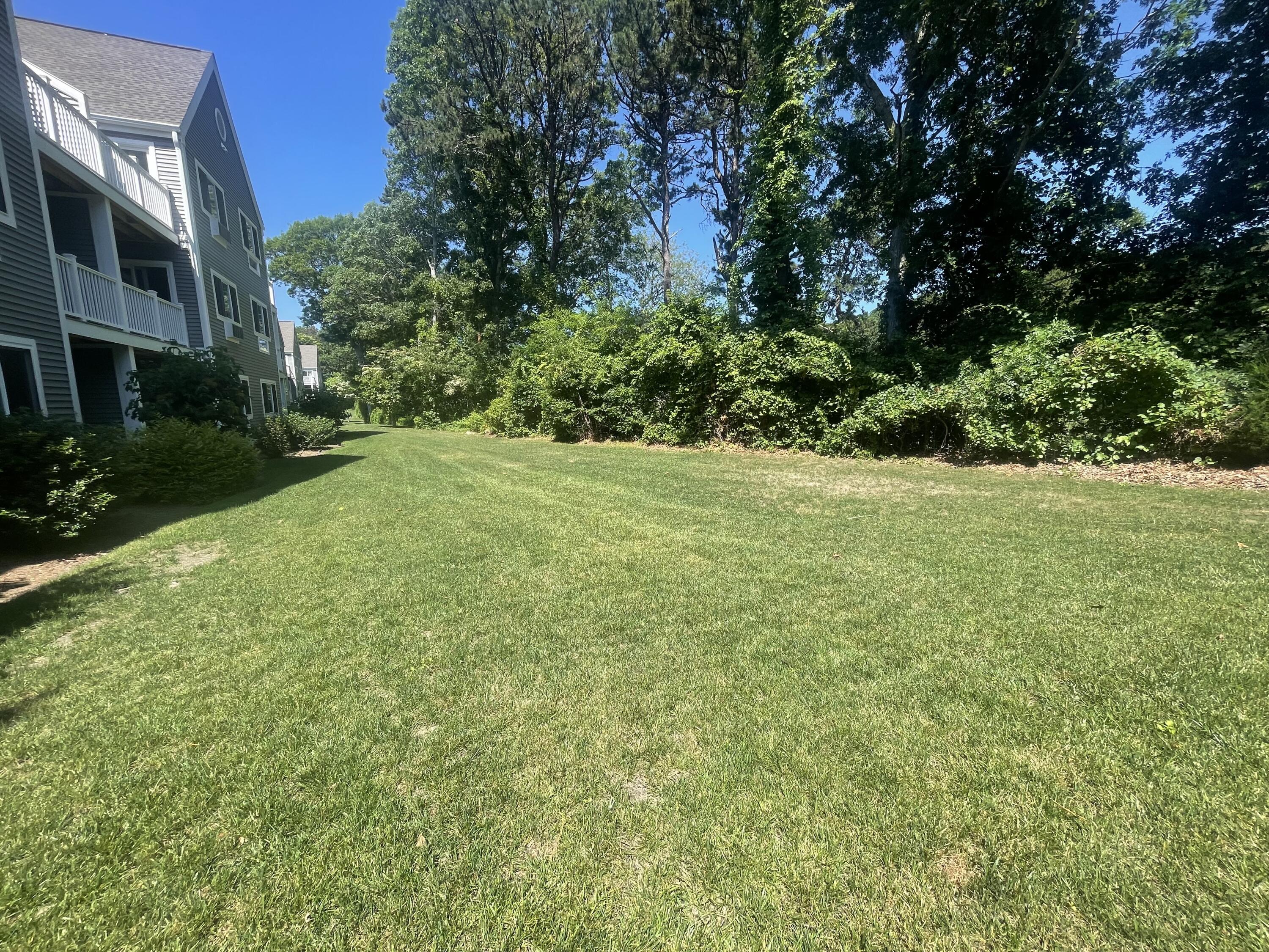 100 Fletcher Lane, Unit G Brewster, MA 02631 - Photo 15 of 30 Green Space Behind Unit
