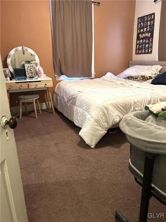 32 West Raspberry Street Bethlehem, PA 18018 - Photo 6 of 10 a bedroom with a bed and a table in it