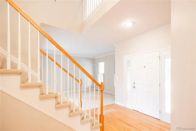 a view of an entryway with wooden floor