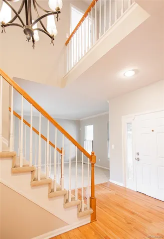 a view of an entryway with wooden floor