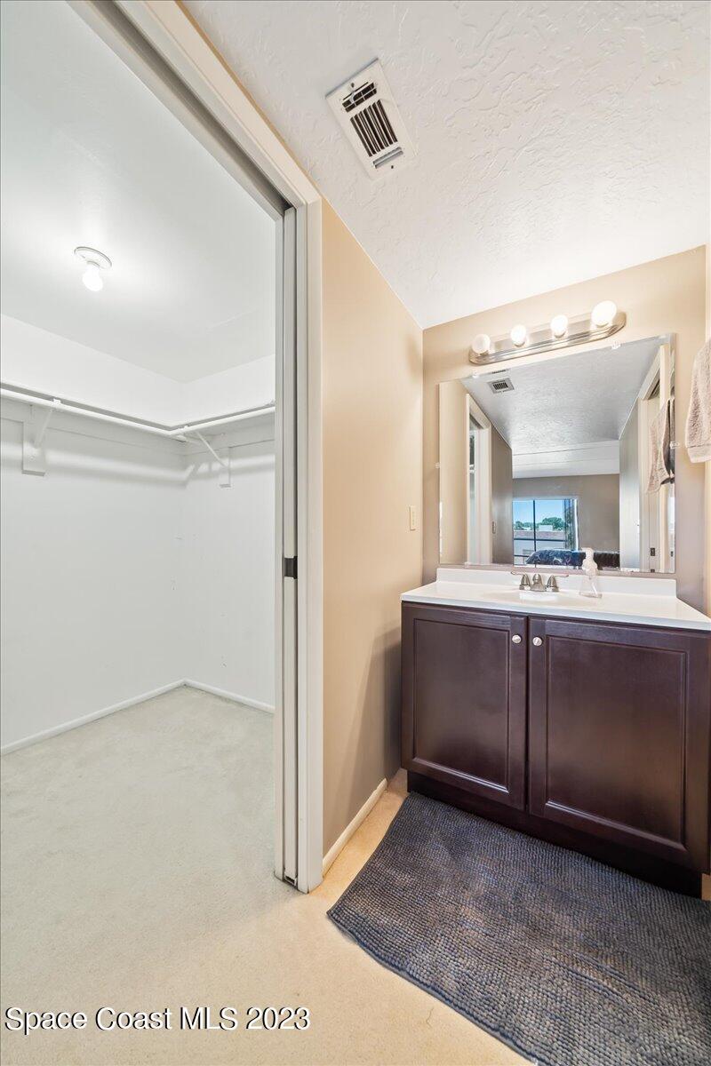 2775 North Wickham Road, Unit 204 Melbourne, FL 32935 - Photo 15 of 24 a view of a hallway with bathroom