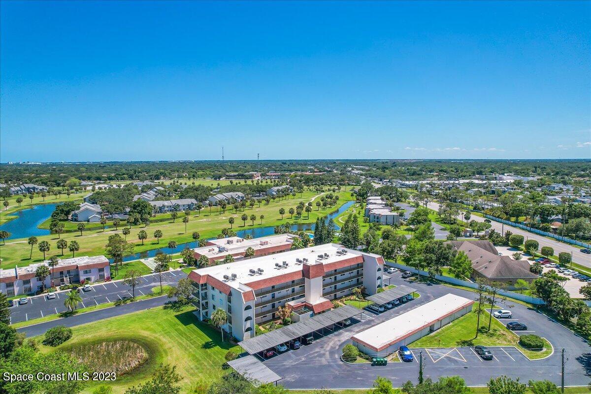 2775 North Wickham Road, Unit 204 Melbourne, FL 32935 - Photo 22 of 24 a view of a city with an ocean view