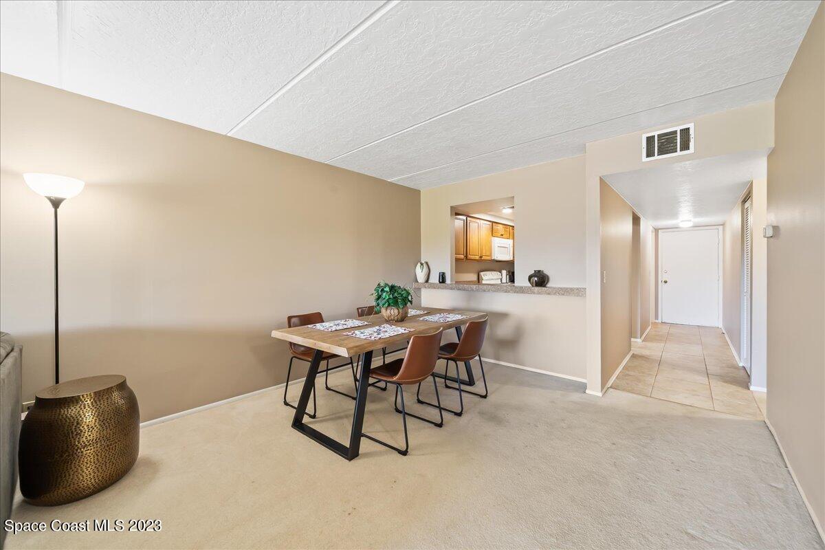 2775 North Wickham Road, Unit 204 Melbourne, FL 32935 - Photo 7 of 24 a workspace with furniture and window
