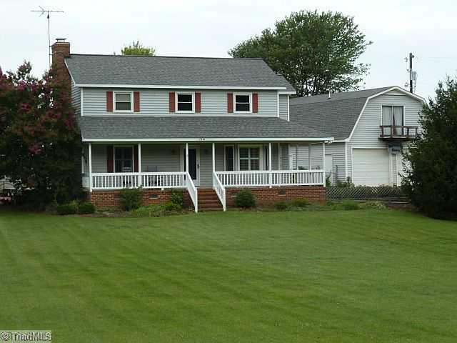 Exterior Front. Wow! Check out that yard!!! Rocking Chair front porch...  Peaceful and quiet country living, yet minutes away from the city...