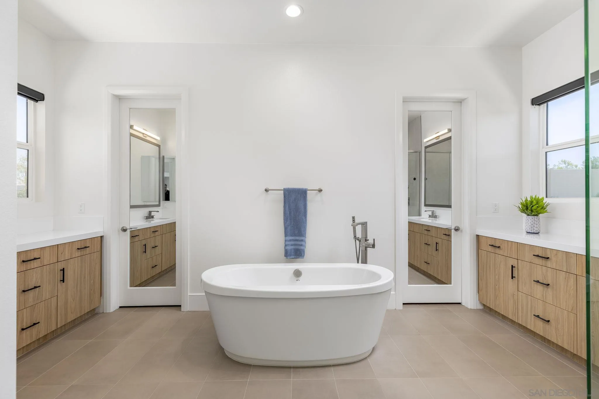 32213 Daybrook Terrace Temecula, CA 92591 - Photo 9 of 23 a bathroom with a bathtub sink and mirror