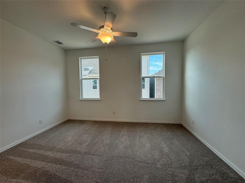 4708 Craymore Road Dallas, TX 75228 - Photo 12 of 16 an empty room with a window
