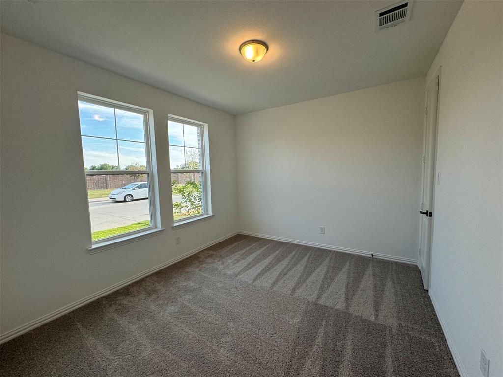 4708 Craymore Road Dallas, TX 75228 - Photo 4 of 16 an empty room with windows