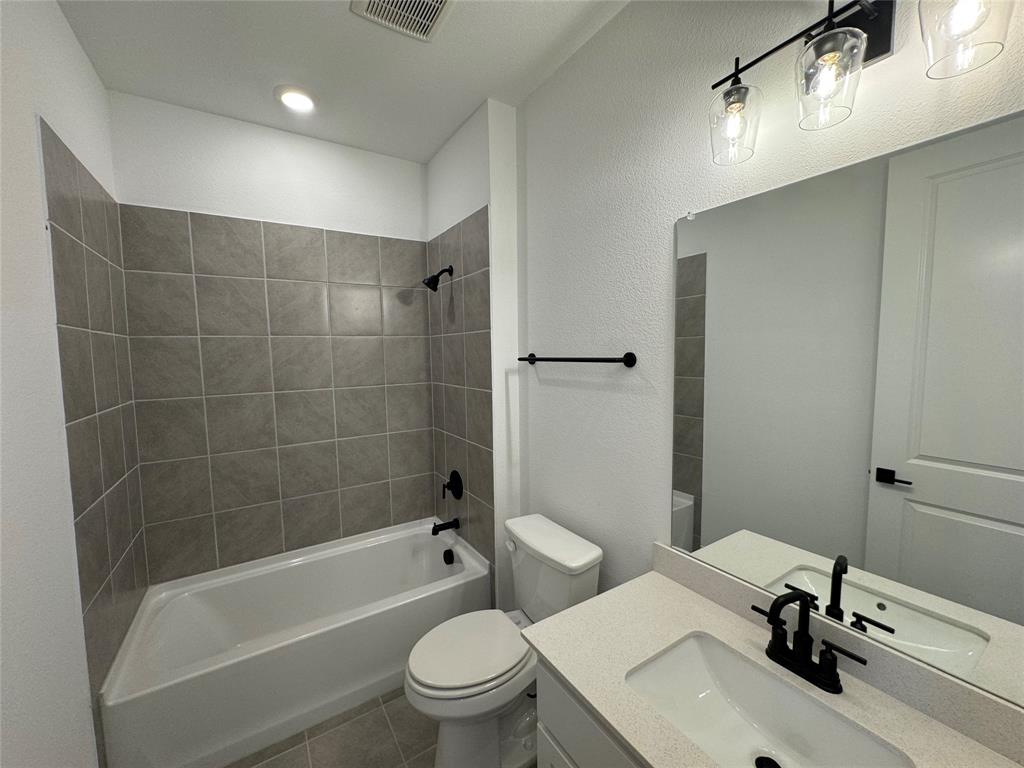 4708 Craymore Road Dallas, TX 75228 - Photo 5 of 16 a bathroom with a sink toilet and shower