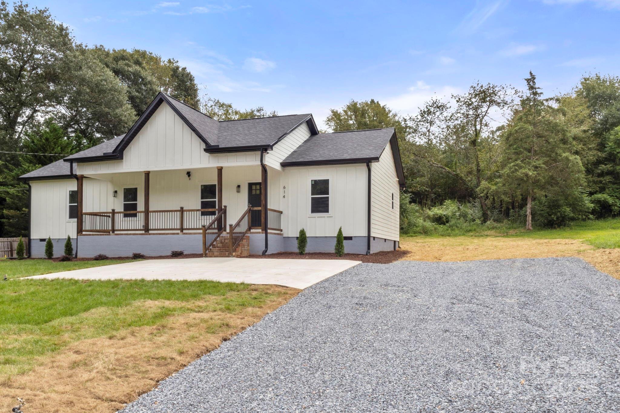 a view of a house with swimming pool and a yard