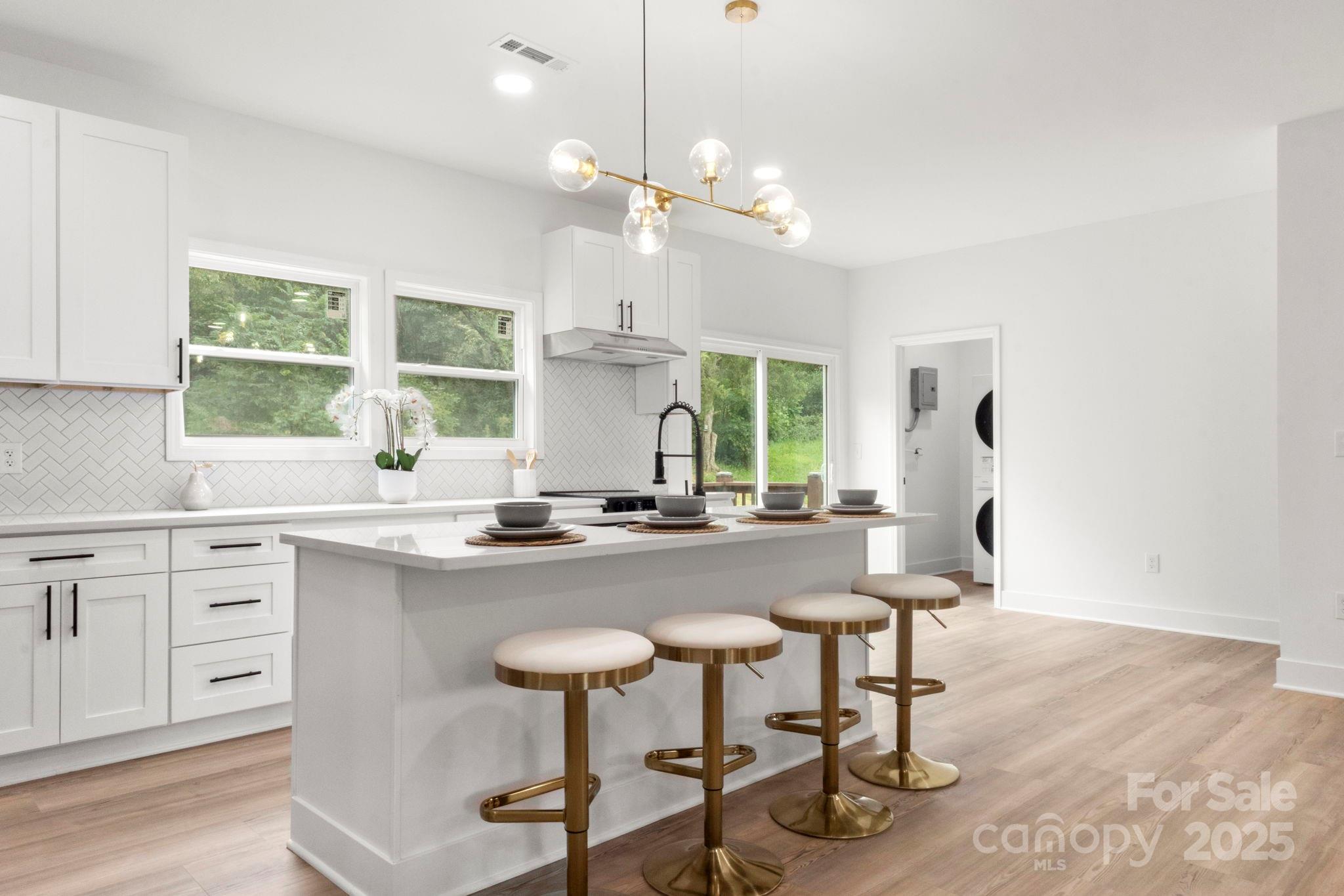 614 Hardin Road Dallas, NC 28034 - Photo 11 of 37 a kitchen with sink cabinets and window