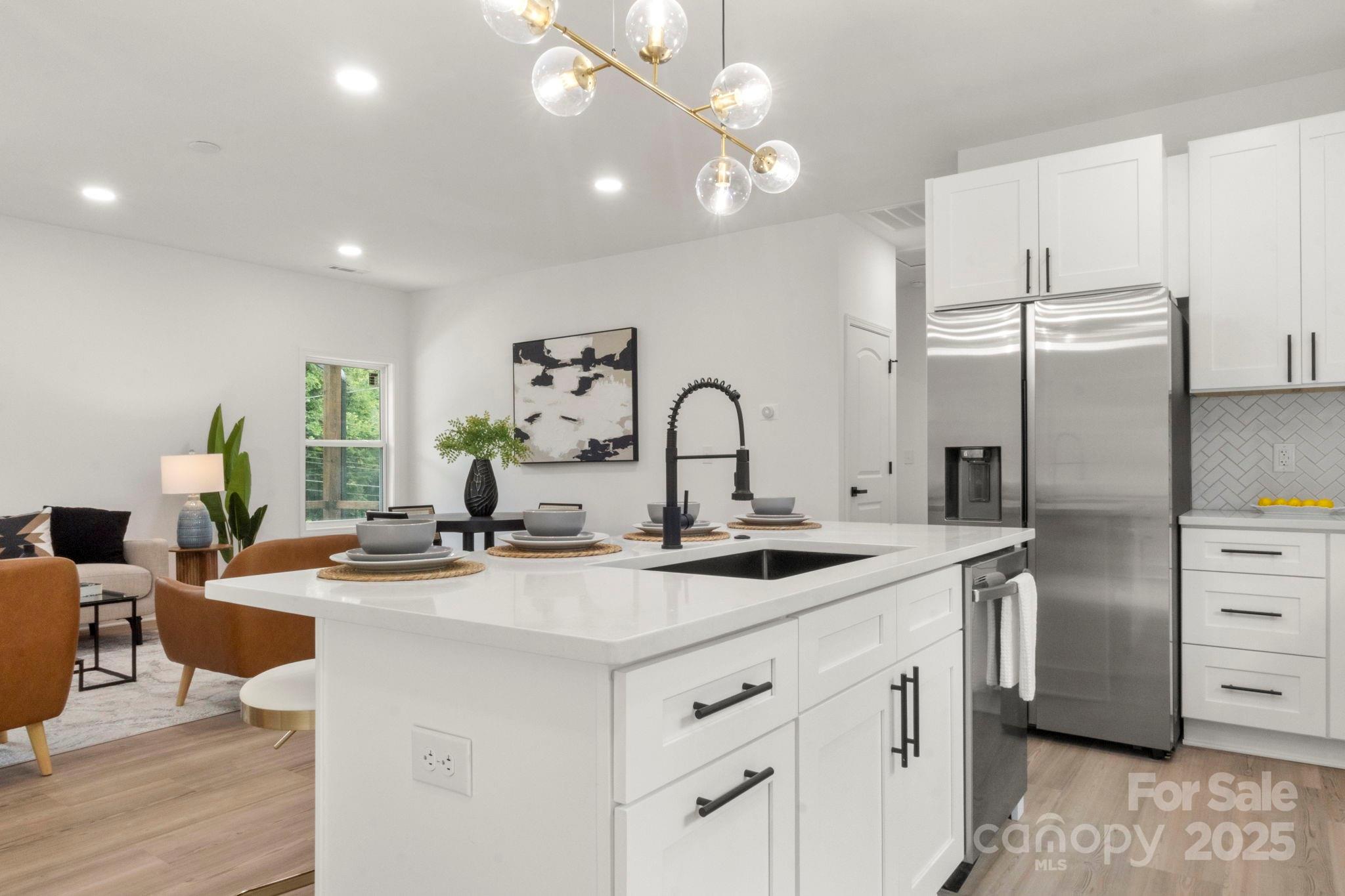 614 Hardin Road Dallas, NC 28034 - Photo 14 of 37 a kitchen with stainless steel appliances granite countertop a sink stove and refrigerator