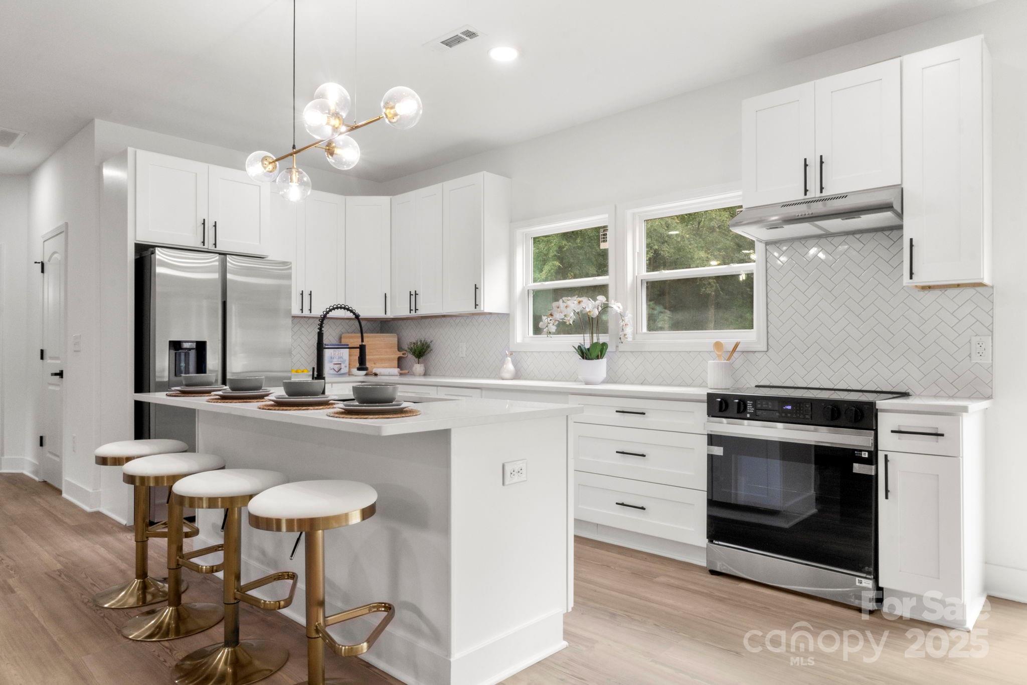 614 Hardin Road Dallas, NC 28034 - Photo 15 of 37 a kitchen with cabinets a sink and appliances