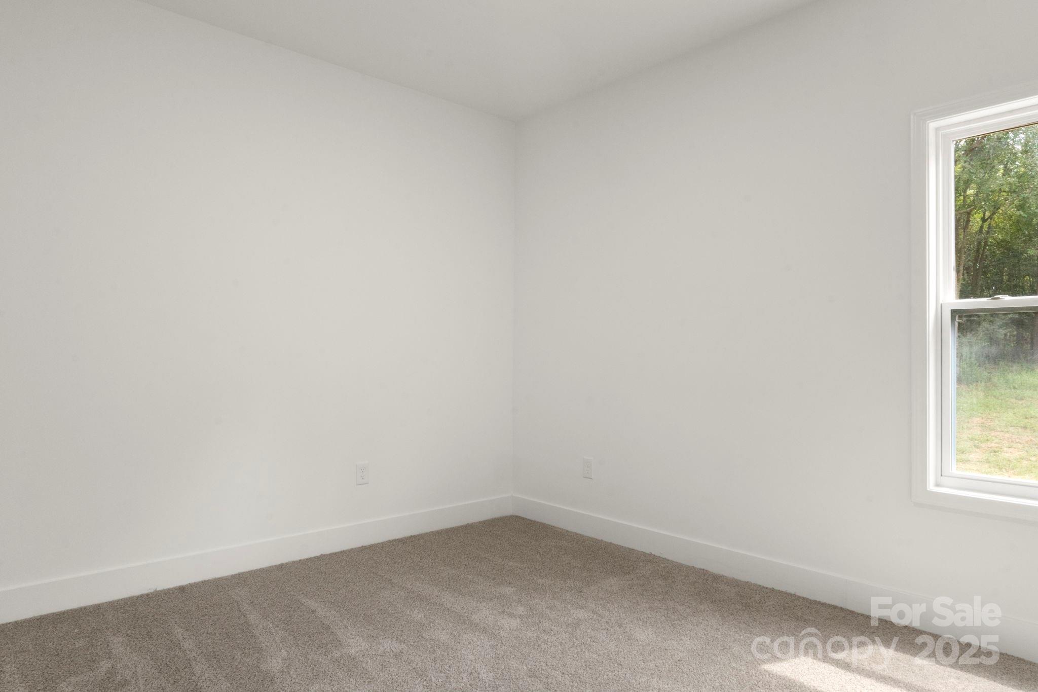 614 Hardin Road Dallas, NC 28034 - Photo 23 of 37 an empty room with a window