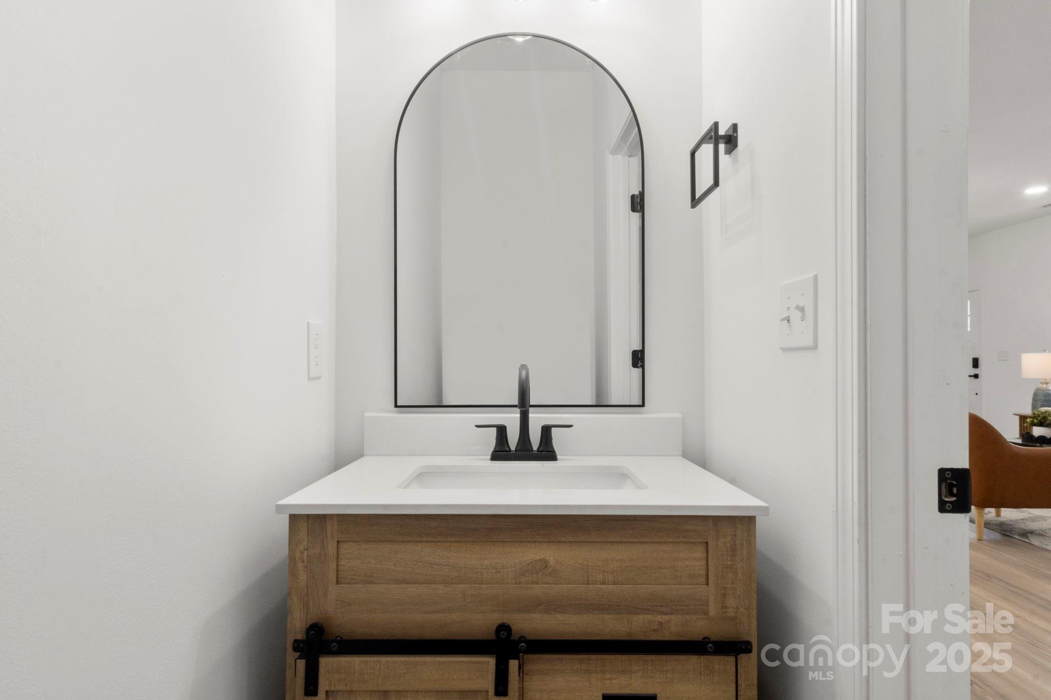 614 Hardin Road Dallas, NC 28034 - Photo 25 of 37 a bathroom with a sink and a mirror