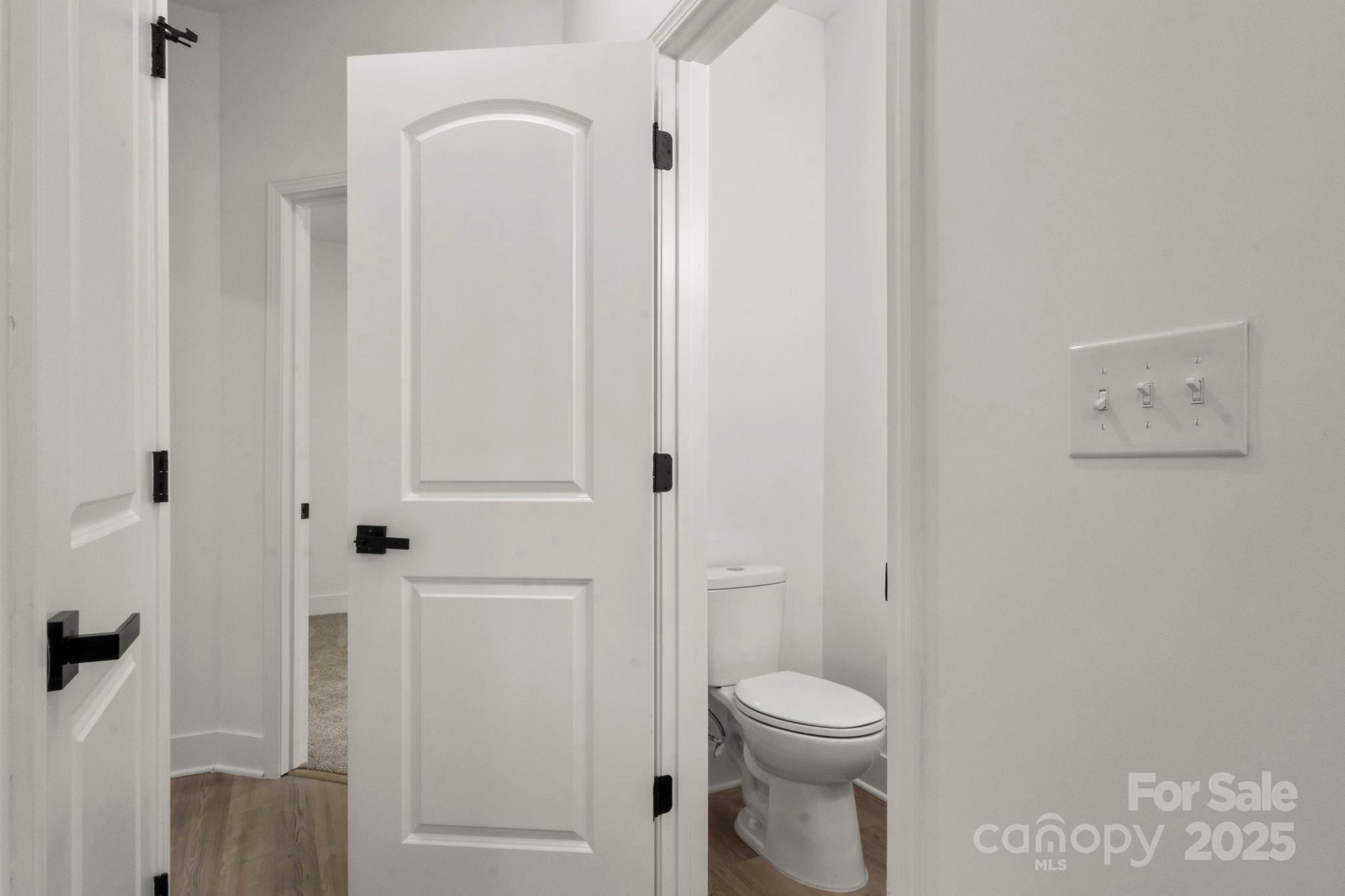614 Hardin Road Dallas, NC 28034 - Photo 26 of 37 a bathroom with a toilet a sink and shower