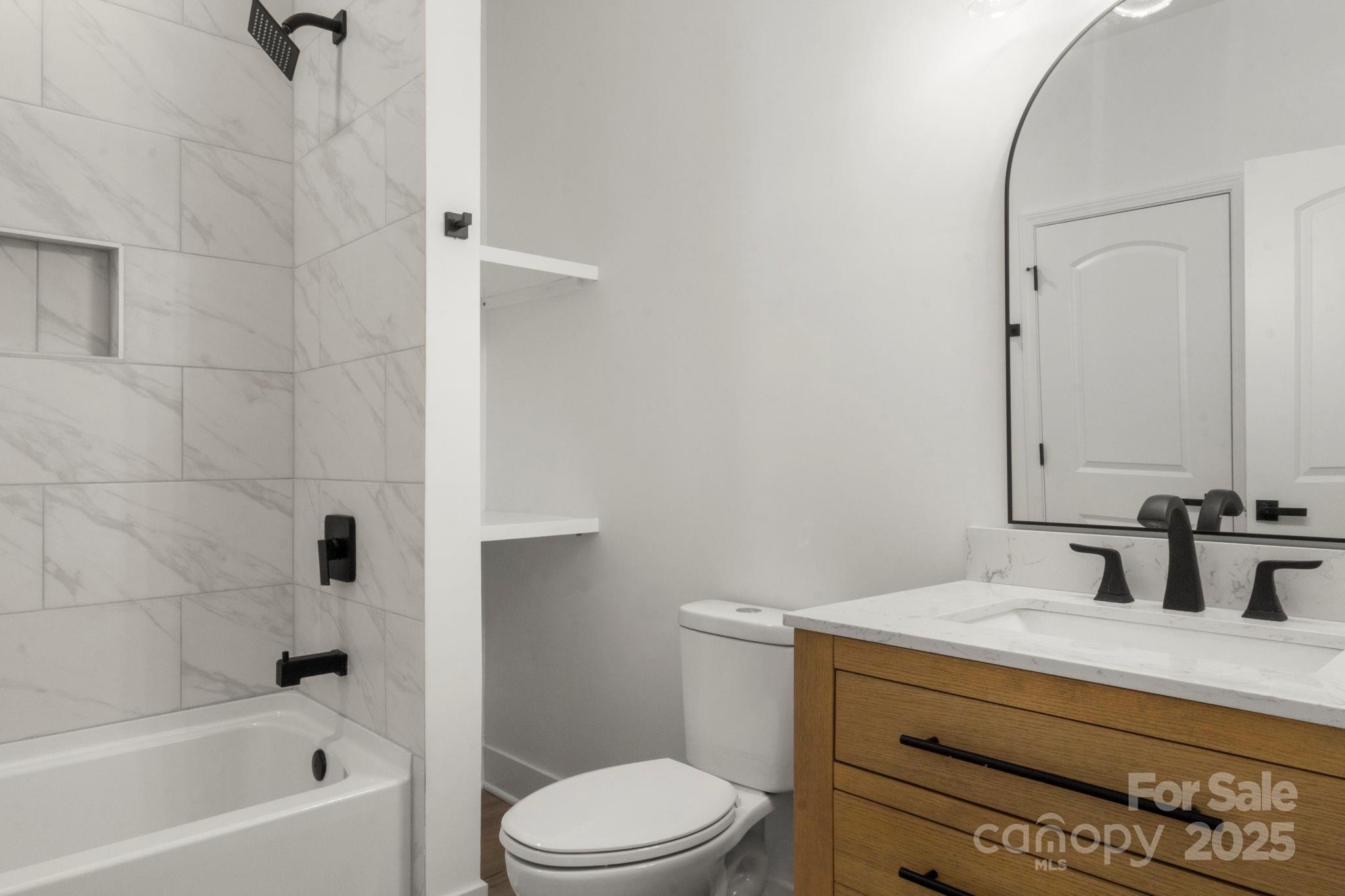 614 Hardin Road Dallas, NC 28034 - Photo 30 of 37 a bathroom with a sink a toilet and shower