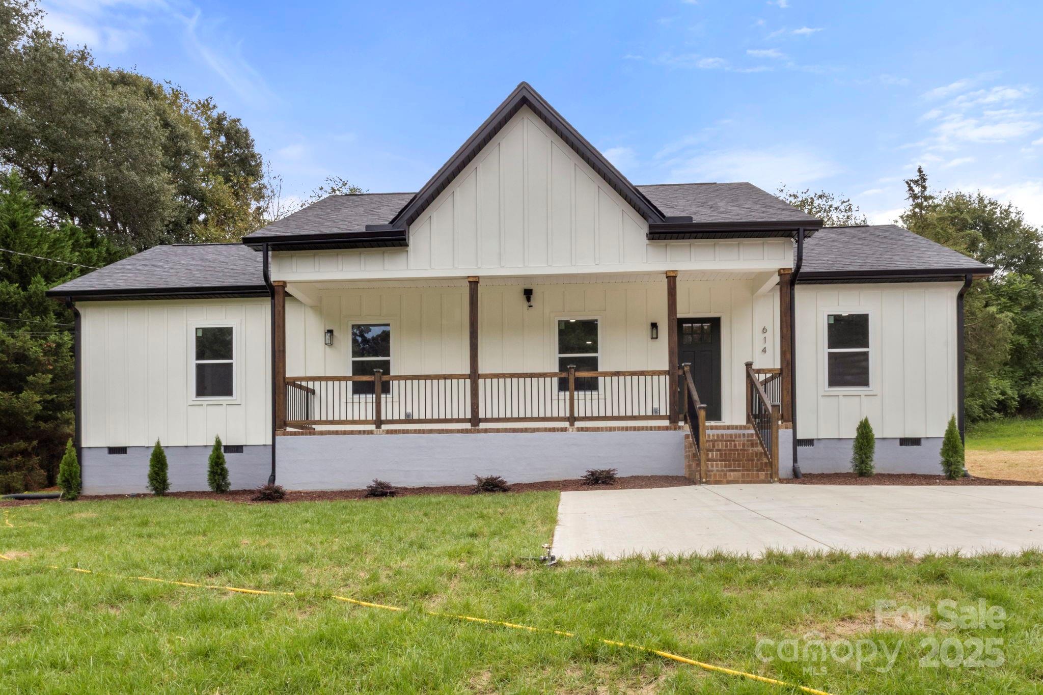 614 Hardin Road Dallas, NC 28034 - Photo 3 of 37 a front view of a house with a yard