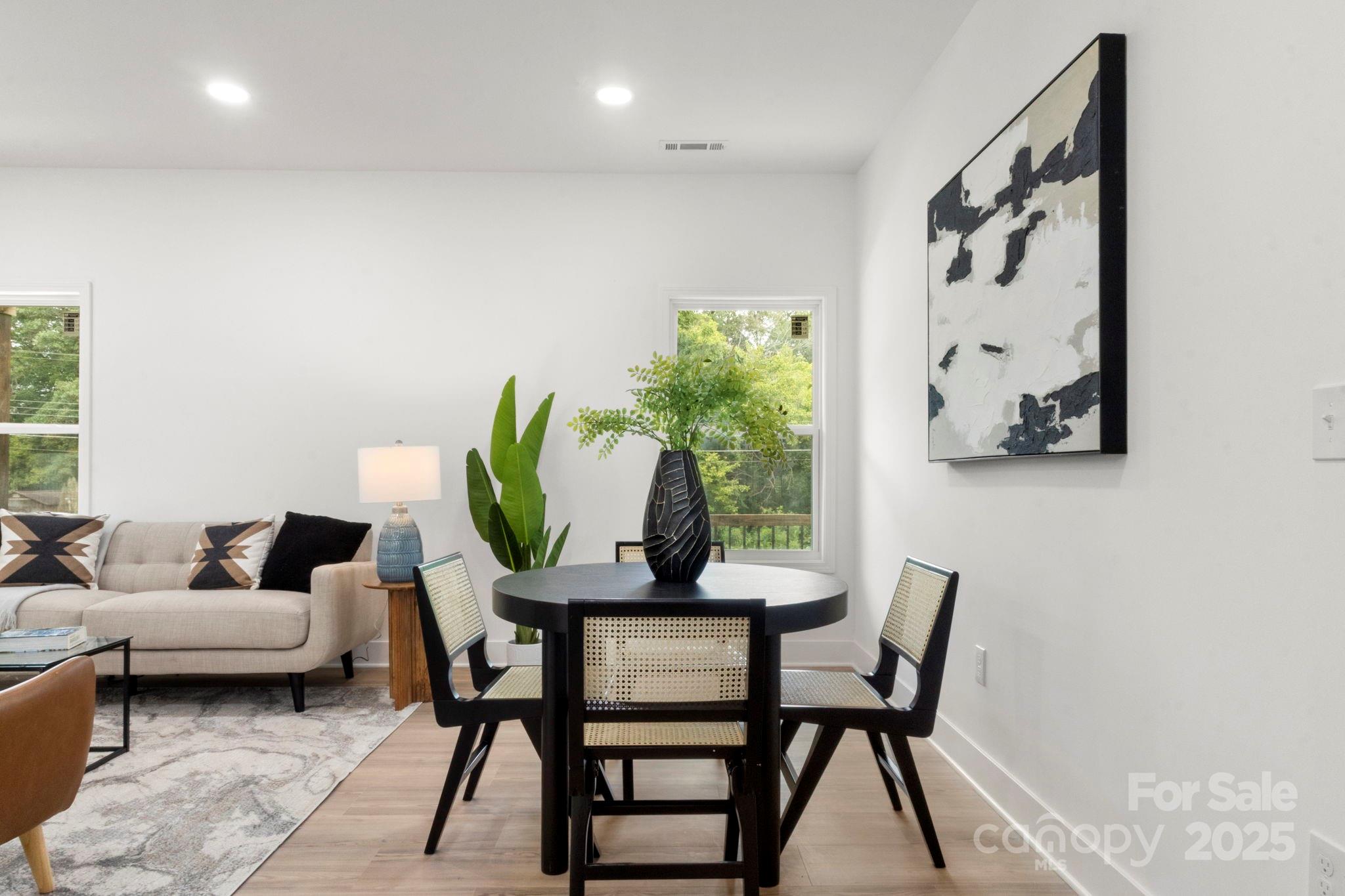 614 Hardin Road Dallas, NC 28034 - Photo 9 of 37 a view of a dining room with furniture and a potted plant