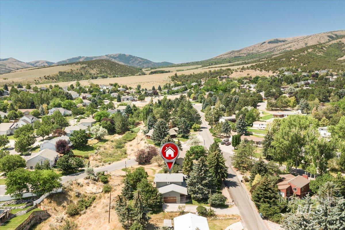 1401 Chokecherry Drive Pocatello, ID 83204 - Photo 45 of 46 Aerial perspective of a residential community featuring mature trees and mountain terrain