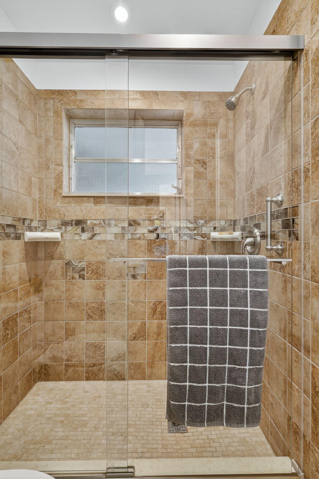 242 West High Point Court, Unit B Delray Beach, FL 33445 - Photo 21 of 36 a bathroom with a shower