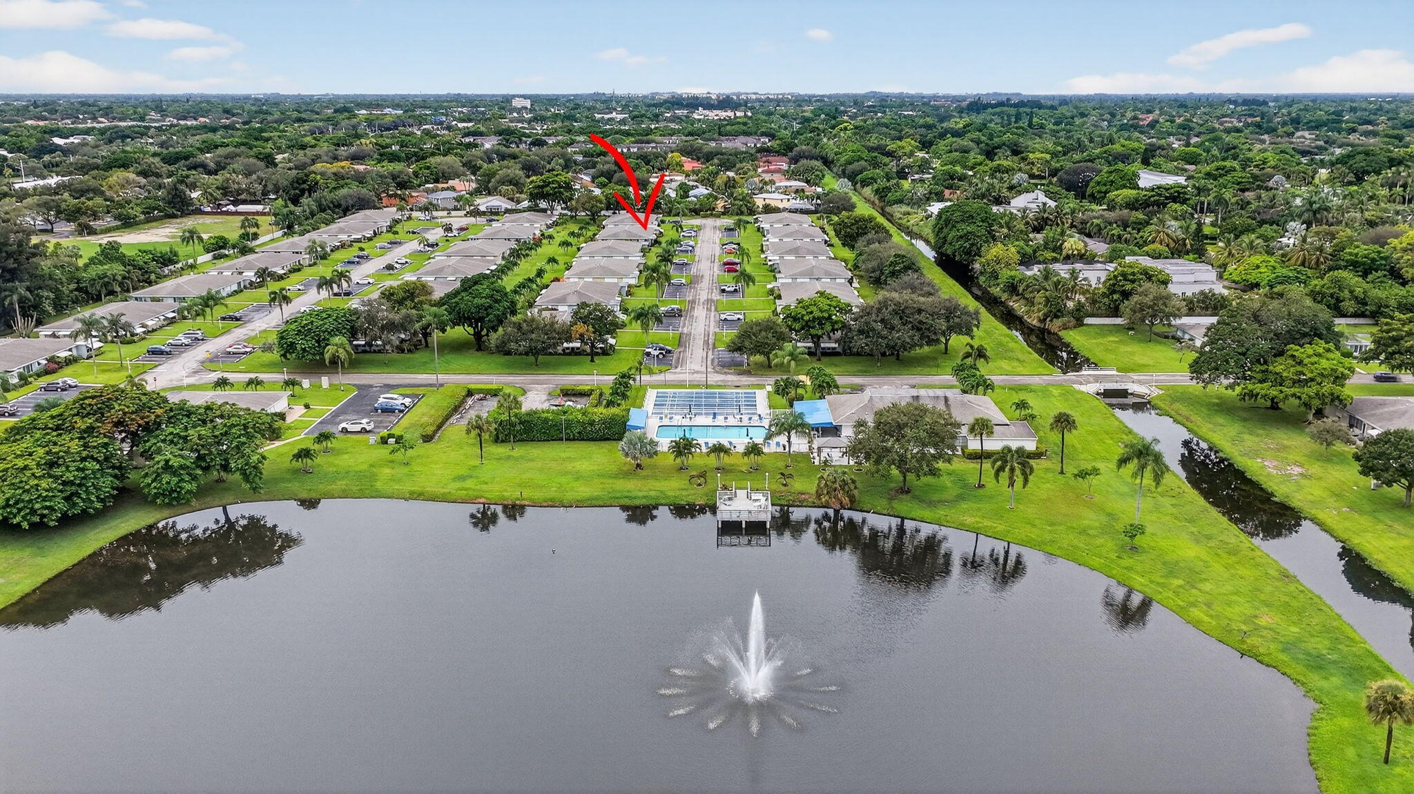 242 West High Point Court, Unit B Delray Beach, FL 33445 - Photo 36 of 36 a view of a lake with a city
