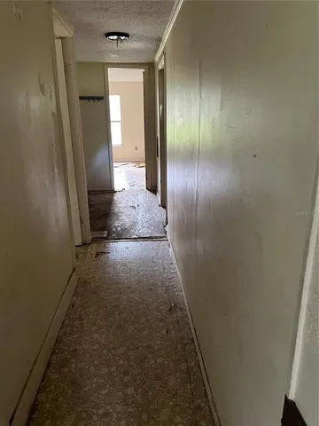 a utility room with a stove and a sink