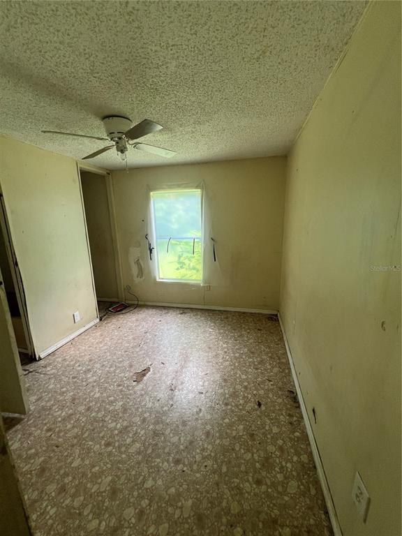 16075 Northwest 37th Terrace Reddick, FL 32686 - Photo 13 of 22 an empty room with a empty space and windows