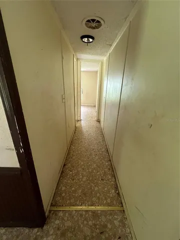 a view of an empty room and a windows