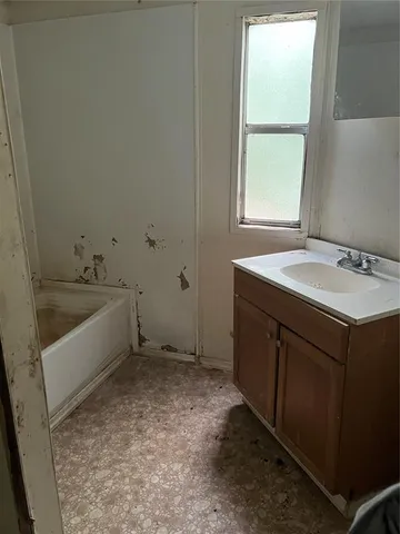 a bathroom with a sink and a bathtub