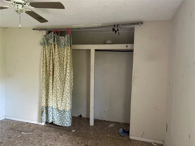 a view of a room with a wooden floor and a window
